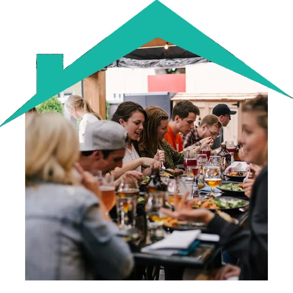 Group of friends enjoying dinner outdoors.